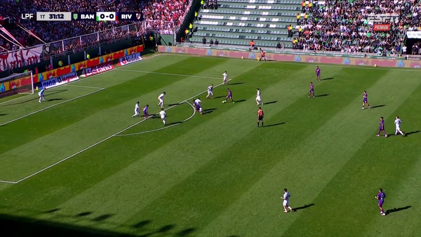 A horizontal soccer frame with a phone outline over the selected 9:16 region. The dimmed areas beside the phone are left out of the vertical crop.